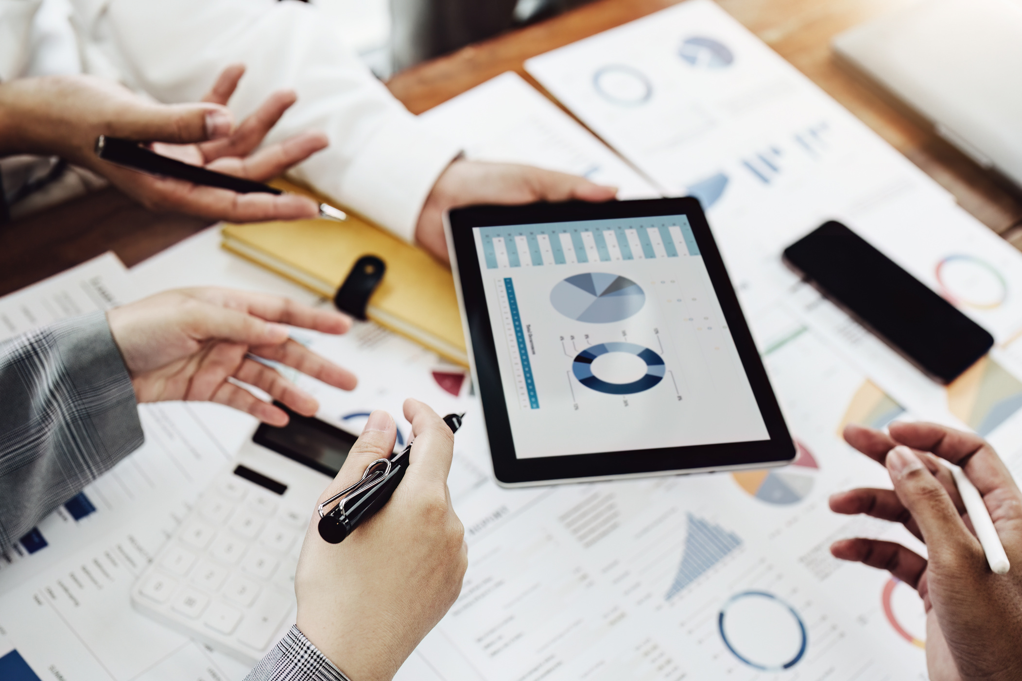businesspeople working with partners adjusting marketing strateg